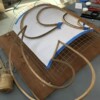 The wood is specially treated to be flexible while wet. once dry it holds its form
